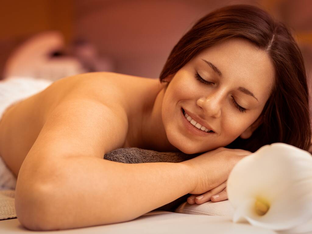 Women getting massage at spa