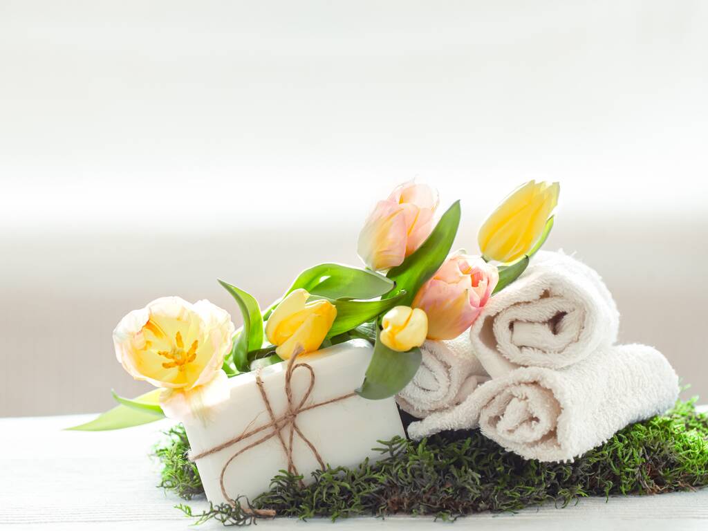 Towels and flowers for spring spa