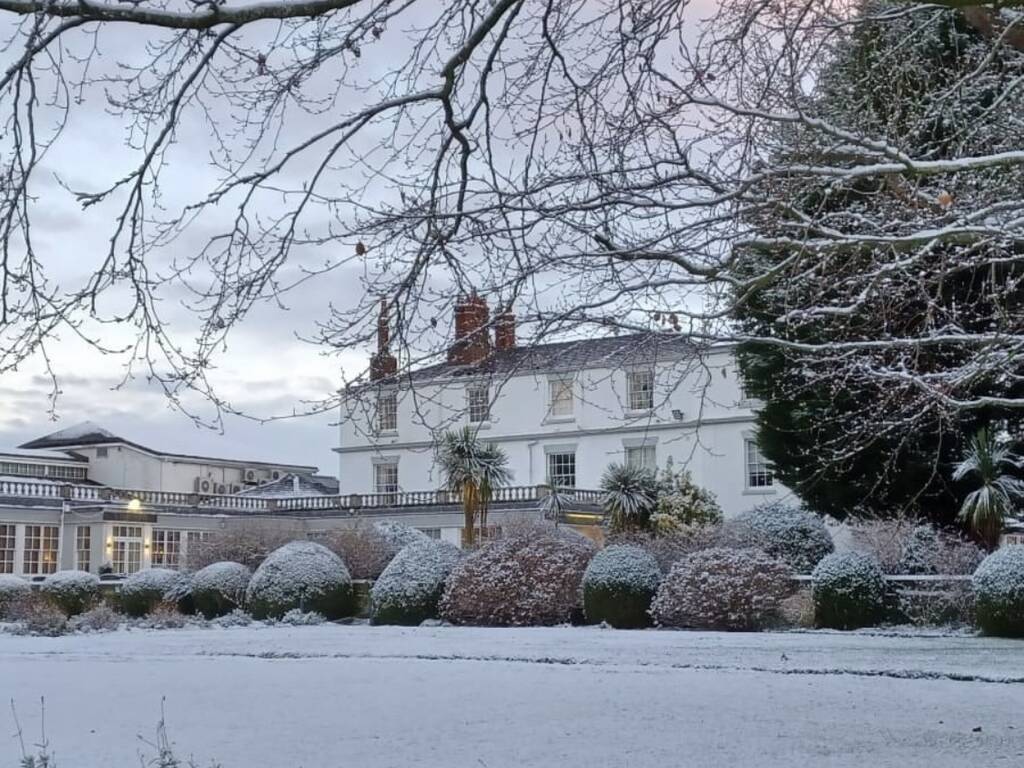 Frosty snowy frontage Rowton Hall Hotel