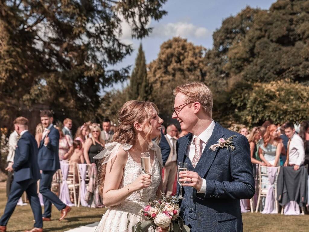 Bride and groom after their wedding ceremony in the gardens at rowton hall hotel