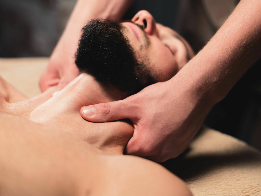 Man receiving a neck massage